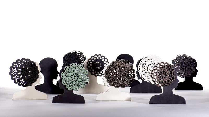 Pierced clay · light passing through the perforated lace pattern